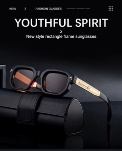 Detail of square frame sunglasses with golden metal temples and arrow relief decoration