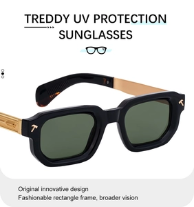 Detailed macro view of gold-plated temple tips with arrow engravings on black square sunglasses