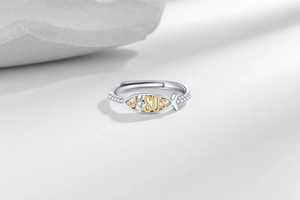 Detailed view of Ichthys Jesus ring with micro-pave diamonds and two-tone finish