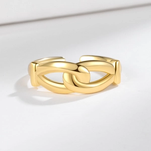 Minimalist double-layer knotted gold ring featuring a unique interlocking open design