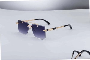 Detail view of gold metal temples and blue gradient square lenses on rimless sunglasses
