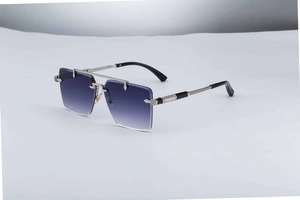 Detailed close-up of blue gradient lenses and silver metal woven temple on rimless sunglasses