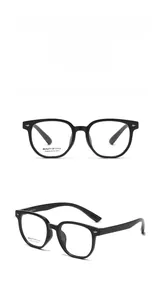 Detail view of stylish square frame glasses in glossy black with premium metal hinges