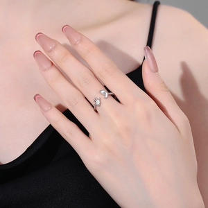 Minimalist adjustable silver ring featuring creative baby hand and footprint design