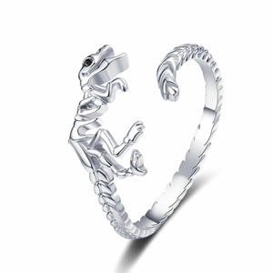 Gothic silver dinosaur skeleton open ring with black gemstone eyes on white background