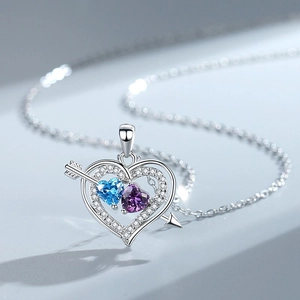 Arrow of Cupid necklace with heart-shaped blue and purple stones and sparkling zirconias