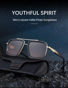 Close-up of black and gold square metal aviator sunglasses with a textured leather case