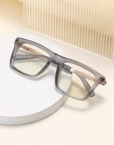 Detailed view of matte gray square frame and gold sparkle temples with size parameters