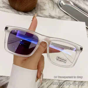 Detail of square frame photochromic lenses changing from clear to dark grey