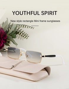 Detail of square gold metal sunglasses with gradient lenses and pink leather case