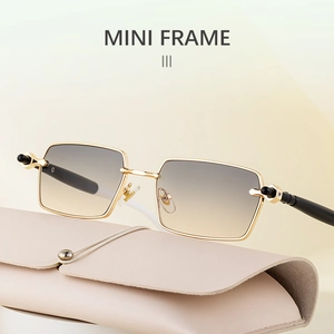 Detail of square gold metal sunglasses with gradient lenses and beige leather case
