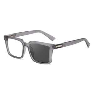 Translucent gray square frame glasses showing photochromic lens tint transition