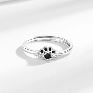 Minimalist silver cat paw ring with black gemstone and wings, adjustable open design
