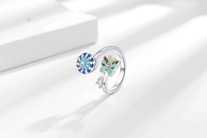 Macro shot of an adjustable enamel butterfly spinning ring with sparkling crystal details