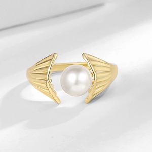 Elegant gold open shell ring with a white pearl accent for a minimalist women's jewelry look