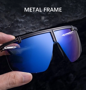 Detailed shot of blue mirrored lenses with a black metal frame on a textured rock background
