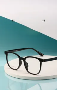 Macro detail of black retro square frame glasses showing temple branding and specifications