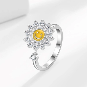 Adjustable sunflower spinner ring with yellow smiley face and sparkling cubic zirconia