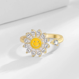 Adjustable golden sunflower fidget ring with rotating smiley face and white cubic zirconia