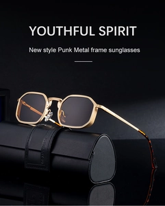 Detail of punk gold metal square sunglasses next to a black leather folding case