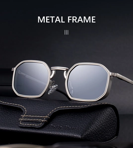 Octagonal metal sunglasses in matte silver with grey lenses and a black leather case