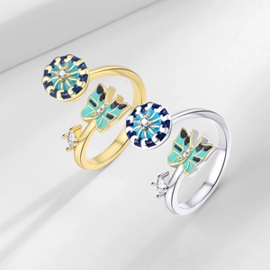 Rotating enamel butterfly and rudder rings in gold and silver with cubic zirconia