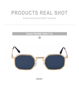 Front view of geometric gold frame sunglasses with dark gray lenses and black temple tips