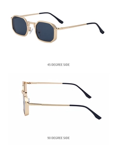 Detail view of gold octagonal metal frame sunglasses with dark lenses from side angles