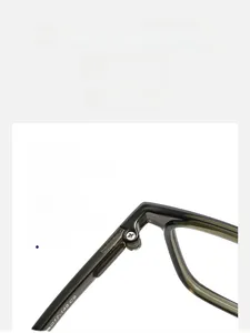 Macro detail of durable metal hinge on green translucent square optical glasses