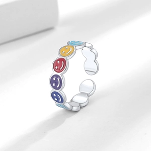 Adjustable silver ring featuring colorful enamel smiley faces in a trendy retro design