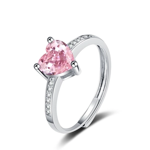 Macro view of heart-shaped pink zircon ring with shimmering micro-pave silver band
