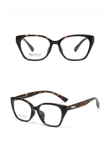 Detailed views of tortoise cat-eye eyeglass frames with gold metal temple accents