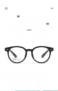 Detail view of model AT68608 round black eyeglass frames with silver metal accents