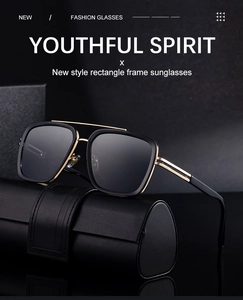 Close-up of golden double bridge and hollow metal hinge design on square sunglasses