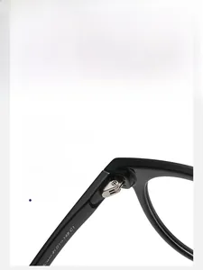 Detailed close-up of sturdy metal hinge and temple specs on black round glasses