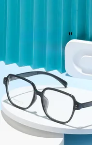 Macro shot of stylish black square eyeglasses frame AT88612 on a geometric display