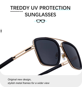 Detailed macro view of square sunglasses featuring black frames and gold hollow temples