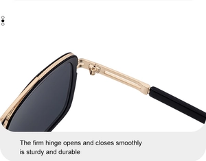 Detailed close-up of durable golden metal hinge on square black sunglasses frame