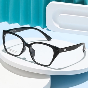 Stylish cat-eye black frame glasses with metallic temples on a creative display stand