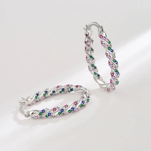 Rainbow twisted hoop earrings with multicolored zircon stones in silver finish