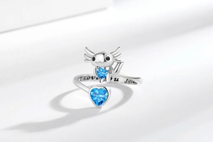 Detail of axolotl ring with blue heart stones and I Love You Forever engraving