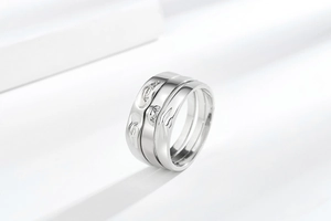 Macro view of silver stackable rings with monster face relief and sparkling zircon stones