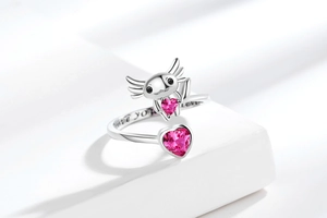 Macro detail of axolotl ring with pink heart stone and Love you forever engraving