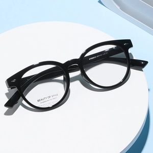 Classic black round frame optical glasses for women with polished finish on white stand