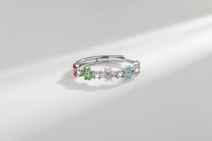 Detail of colorful enamel daisy ring with micro-set zircons on silver adjustable band