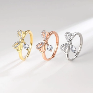 Sparkling bow-knot open ring with dangling round crystal in gold, rose gold and silver