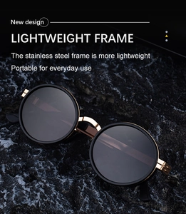 Close-up of retro oval polarized sunglasses with black frame and gold stainless steel detail