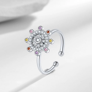 Rotating star chart spinner ring with colorful zircons in polished silver finish