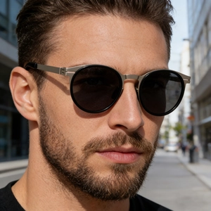 Close-up of vintage oval polarized sunglasses with black frame and silver metal bridge