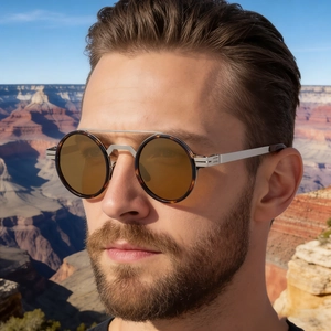 Close-up of retro polarized sunglasses with tortoise frame and metal double bridge on model